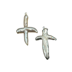 Two silver-toned cross-shaped pendant charms with a textured, organic surface, displayed on a plain white background.