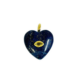 A heart-shaped lapis lazuli pendant with a gold eye motif in the center and a gold bail at the top, shown on a plain white background.