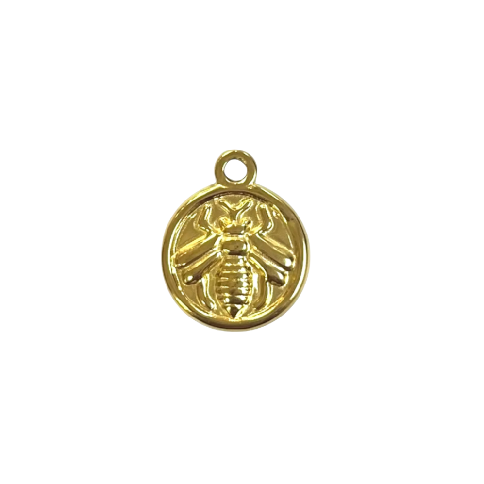 A small round gold charm featuring an embossed bee design, shown on a plain white background.