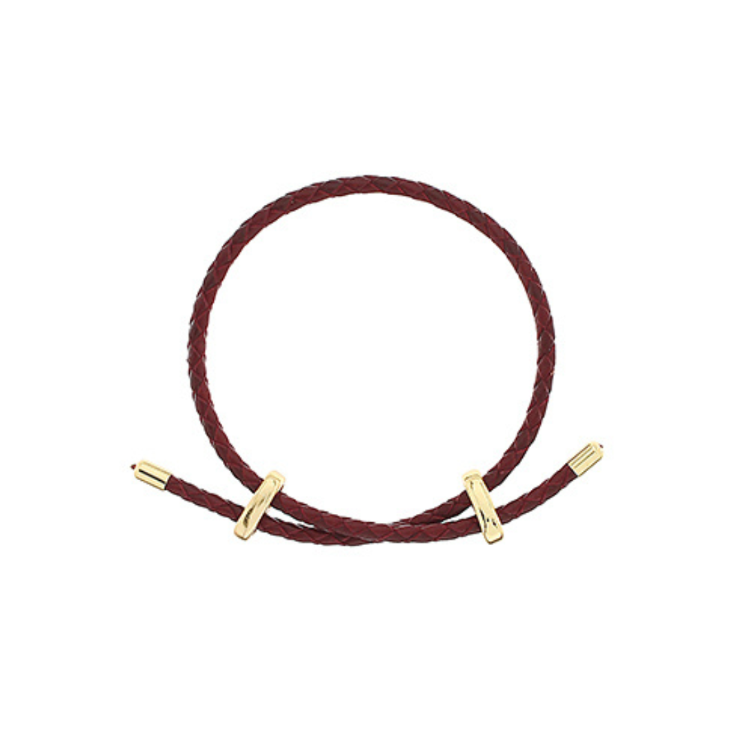 A dark burgundy braided cord bracelet with gold-toned toggle sliders, displayed on a clean white background.