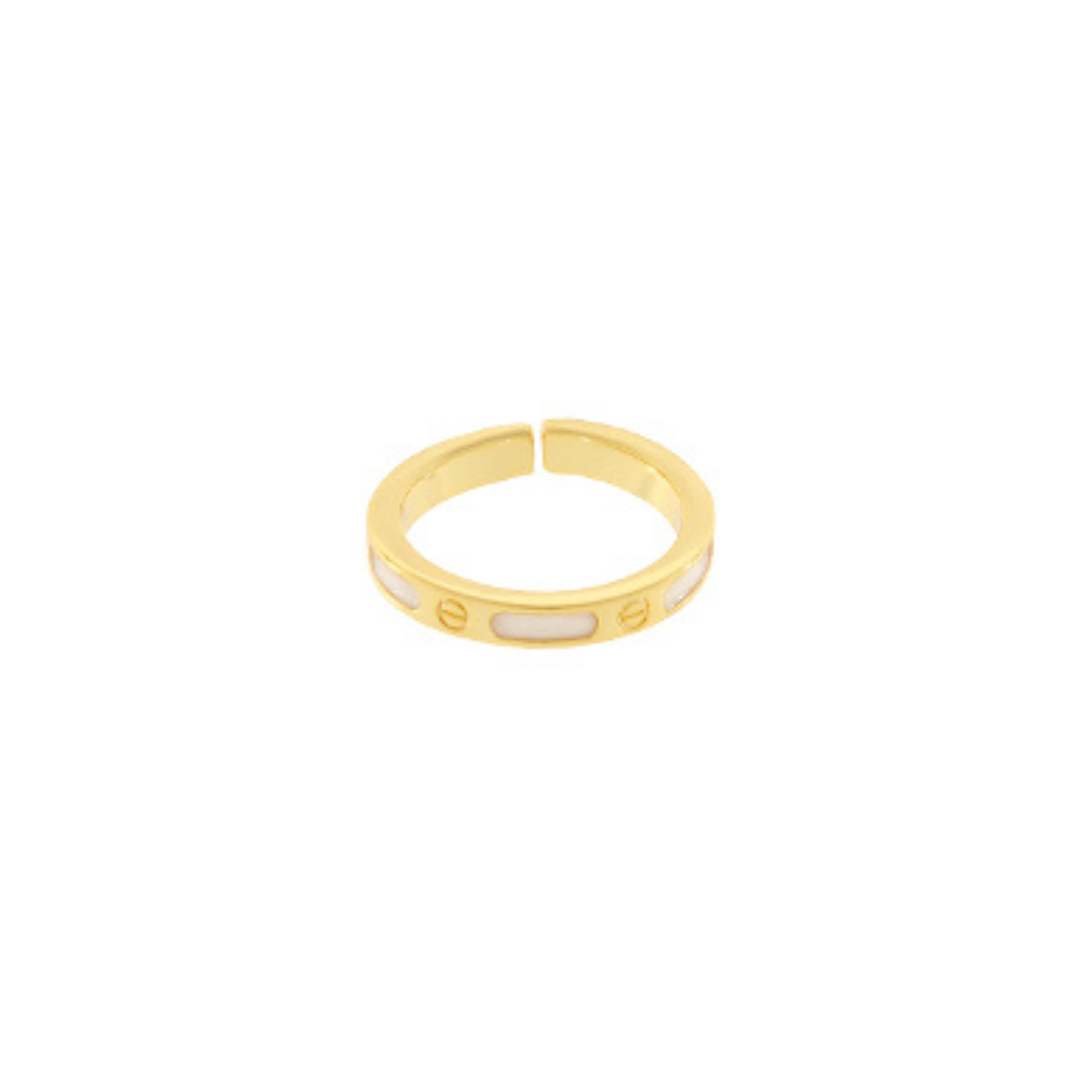 A gold-plated adjustable ring with three white inlaid oval segments, photographed on a solid white background.