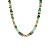 A beaded necklace featuring faceted green stone beads and textured gold spacer beads, arranged in a U-shape on a plain white background.