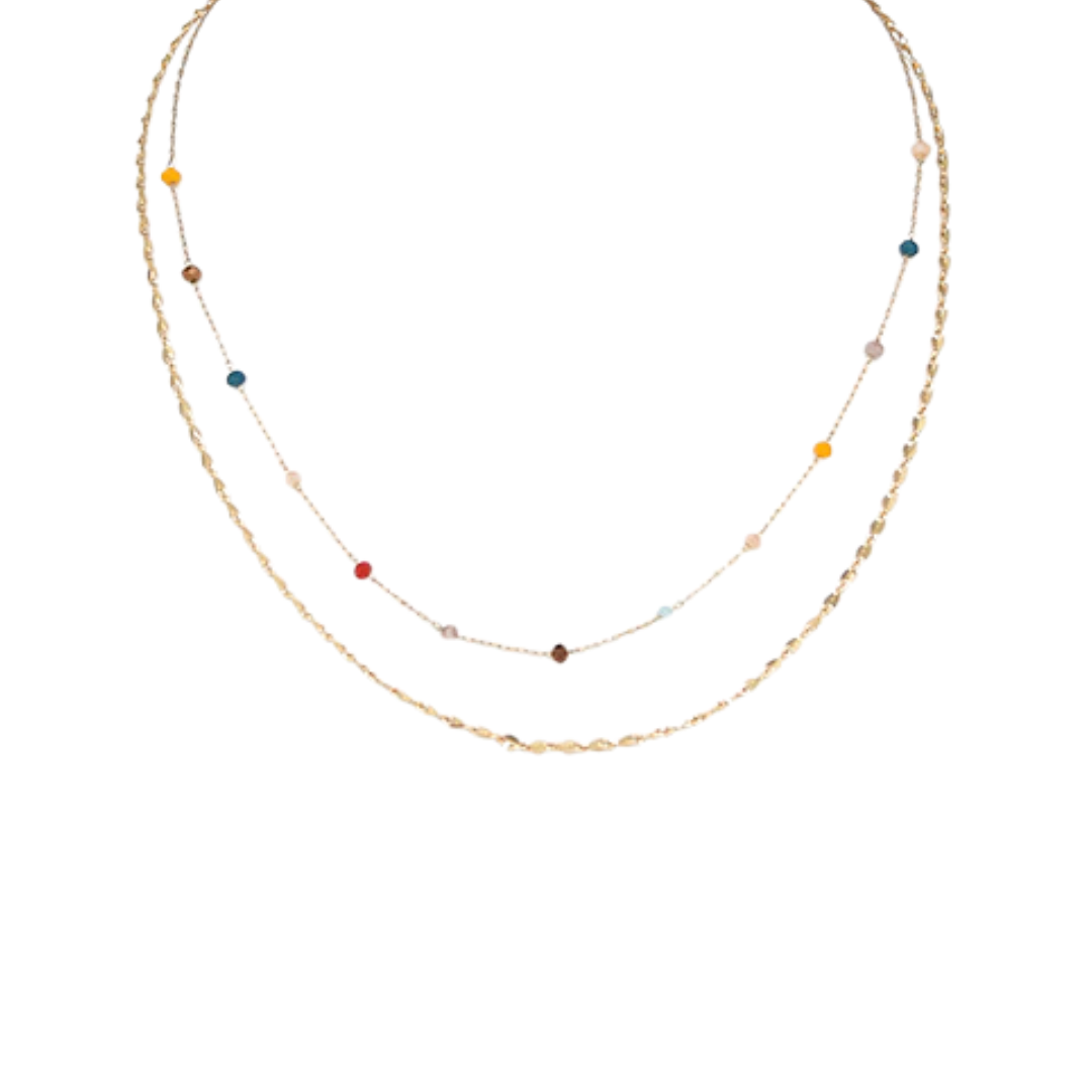 A delicate double-layered necklace featuring one textured gold chain and one fine chain with small, scattered colorful beads in yellow, red, blue, brown, and white, displayed on a solid white background.