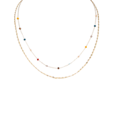 A delicate double-layered necklace featuring one textured gold chain and one fine chain with small, scattered colorful beads in yellow, red, blue, brown, and white, displayed on a solid white background.