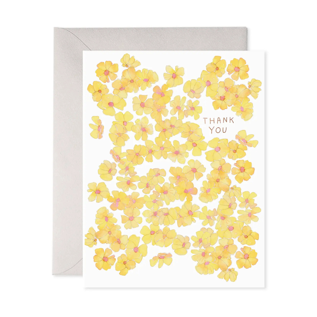 Greeting card with yellow floral pattern and envelope on a white background