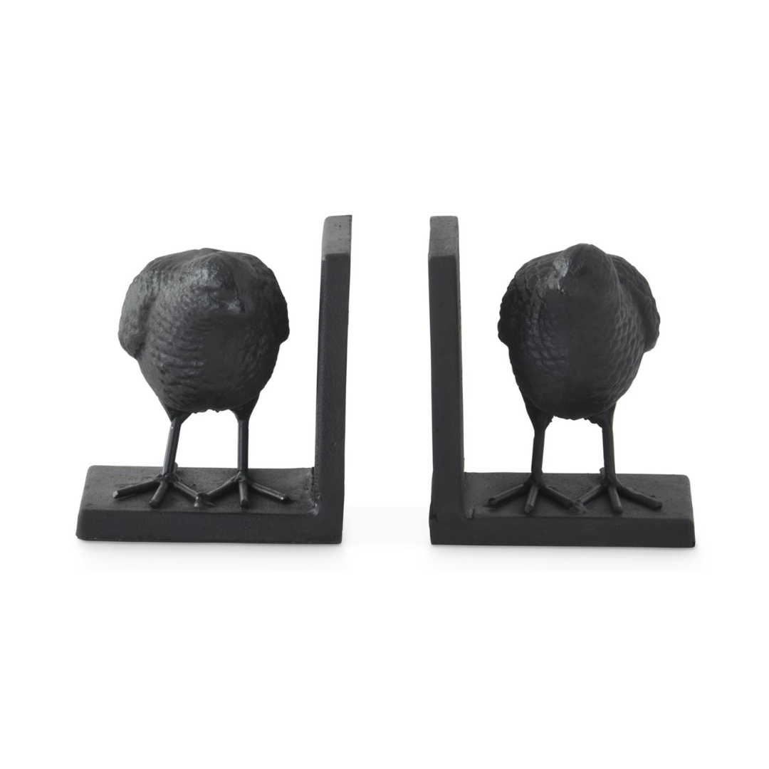 A pair of black metal bird bookends shaped like small birds standing on rectangular bases, shown on a plain white background.