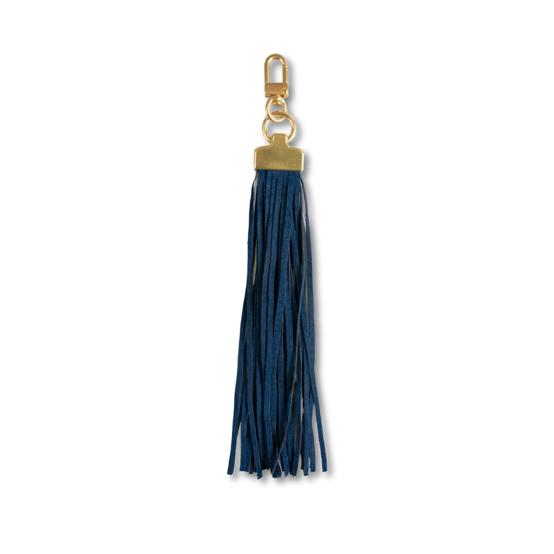 A dark blue faux-leather tassel keychain with gold-tone hardware, including a lobster clasp, ring, and rectangular connector, shown on a plain white background.