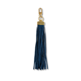 A dark blue faux-leather tassel keychain with gold-tone hardware, including a lobster clasp, ring, and rectangular connector, shown on a plain white background.
