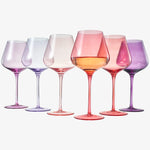 Set of six colorful wine glasses on a white background