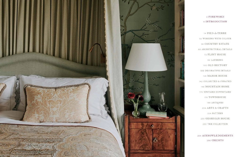 Bedroom with canopy bed and wooden nightstand, featuring a lamp and decorative items.