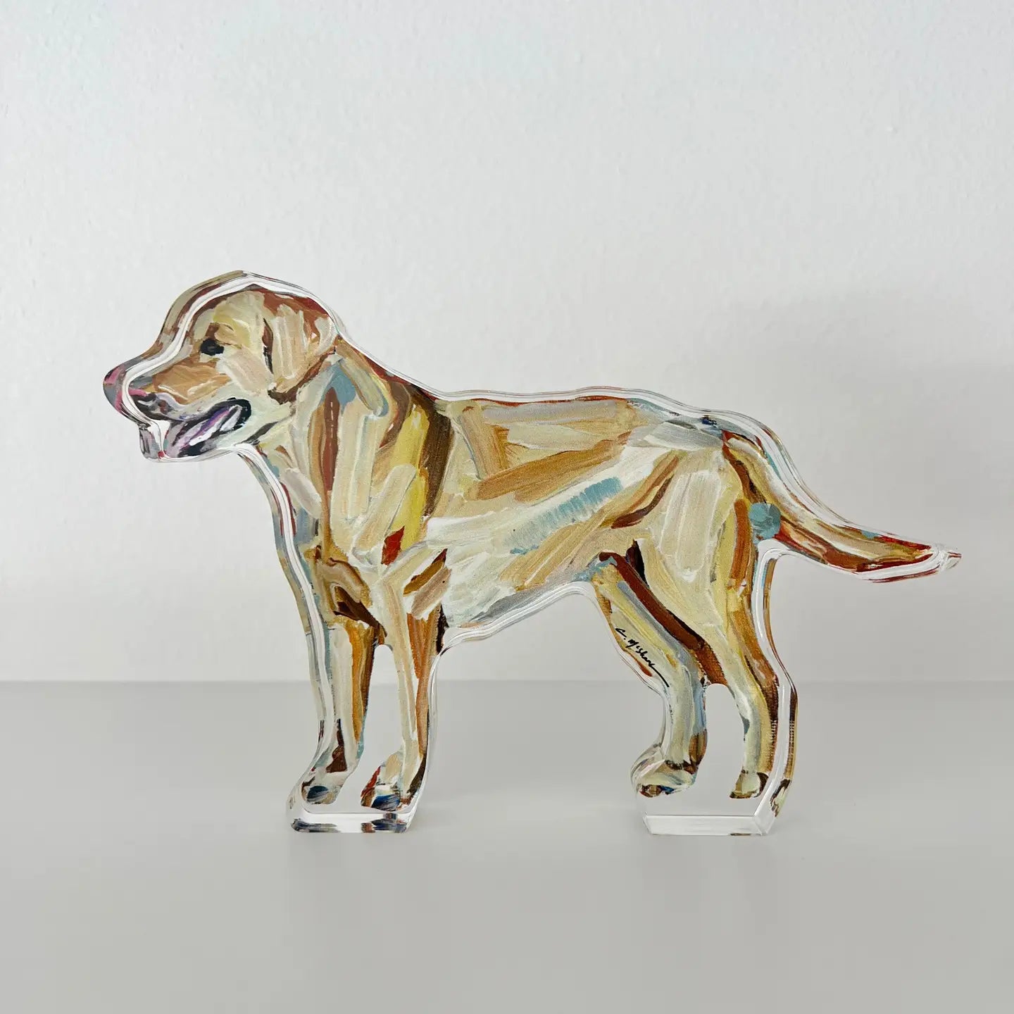 Glass sculpture of a dog on a white background