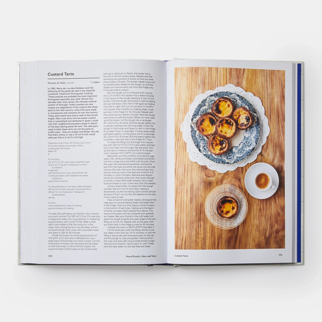Open cookbook showing a page with text and an image of a dessert on a wooden board.