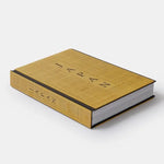 Book with gold cover and black text on a white background