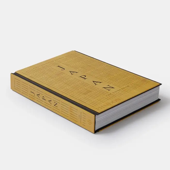 Book with gold cover and black text on a white background