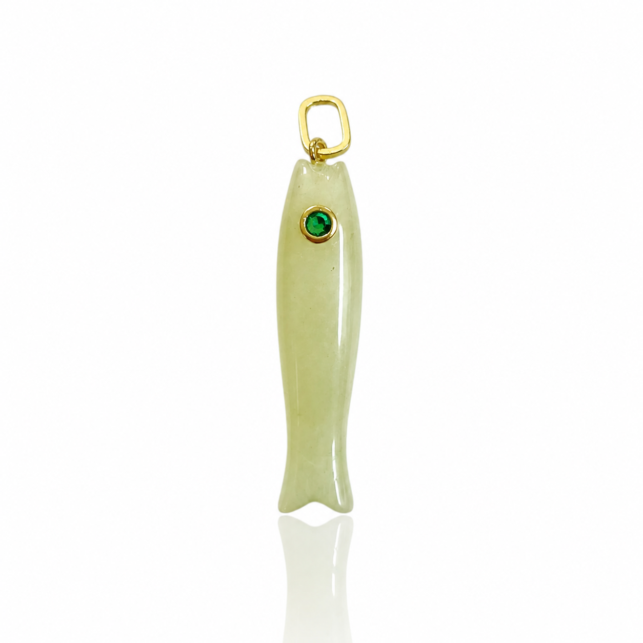 A fish-shaped pendant charm made of pale green stone with a small green gemstone for an eye and a gold-tone loop at the top, shown on a white background.