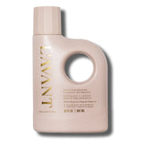 Pink laundry detergent bottle with gold text on a white background