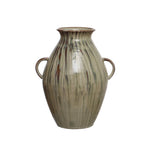 hand-painted stoneware vase with twin handles and a reactive glaze of cream, green, and brown on a white background