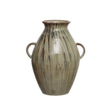 hand-painted stoneware vase with twin handles and a reactive glaze of cream, green, and brown on a white background