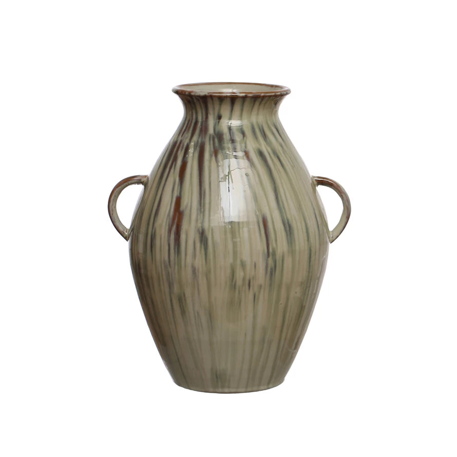 hand-painted stoneware vase with twin handles and a reactive glaze of cream, green, and brown on a white background