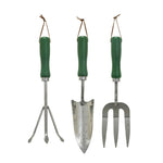 Set of three gardening tools with green handles on a white background