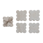 set of four travertine scalloped coasters tied together with jute rope