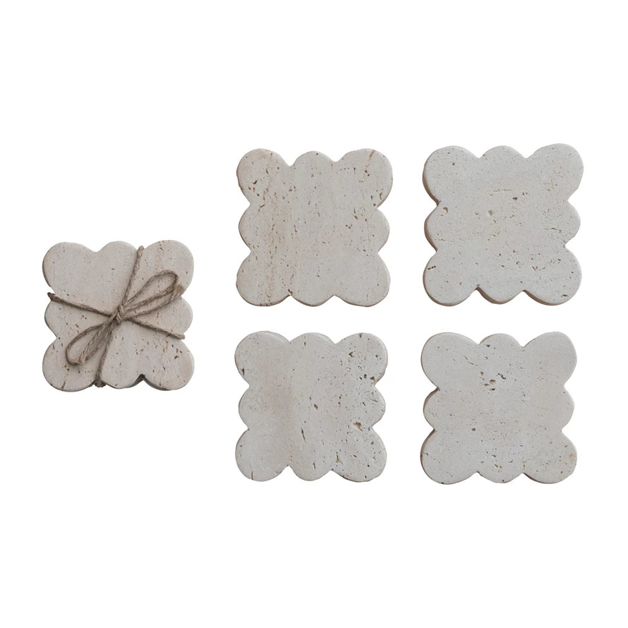 set of four travertine scalloped coasters tied together with jute rope