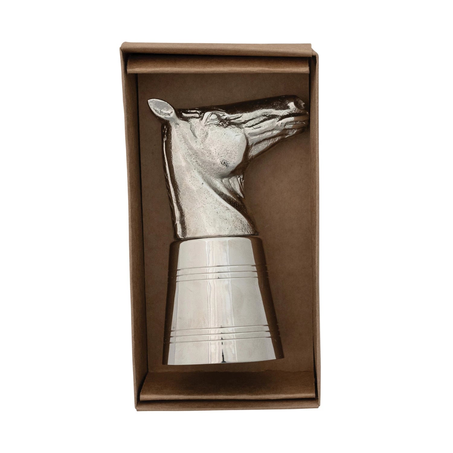 Metallic horse-shaped jigger in a brown box on a white background