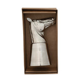 Metallic horse-shaped jigger in a brown box on a white background