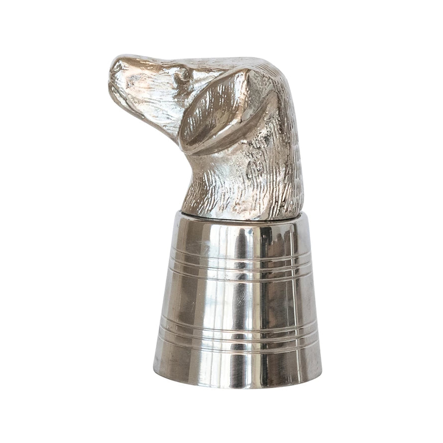 Metallic dog-shaped jigger on a white background