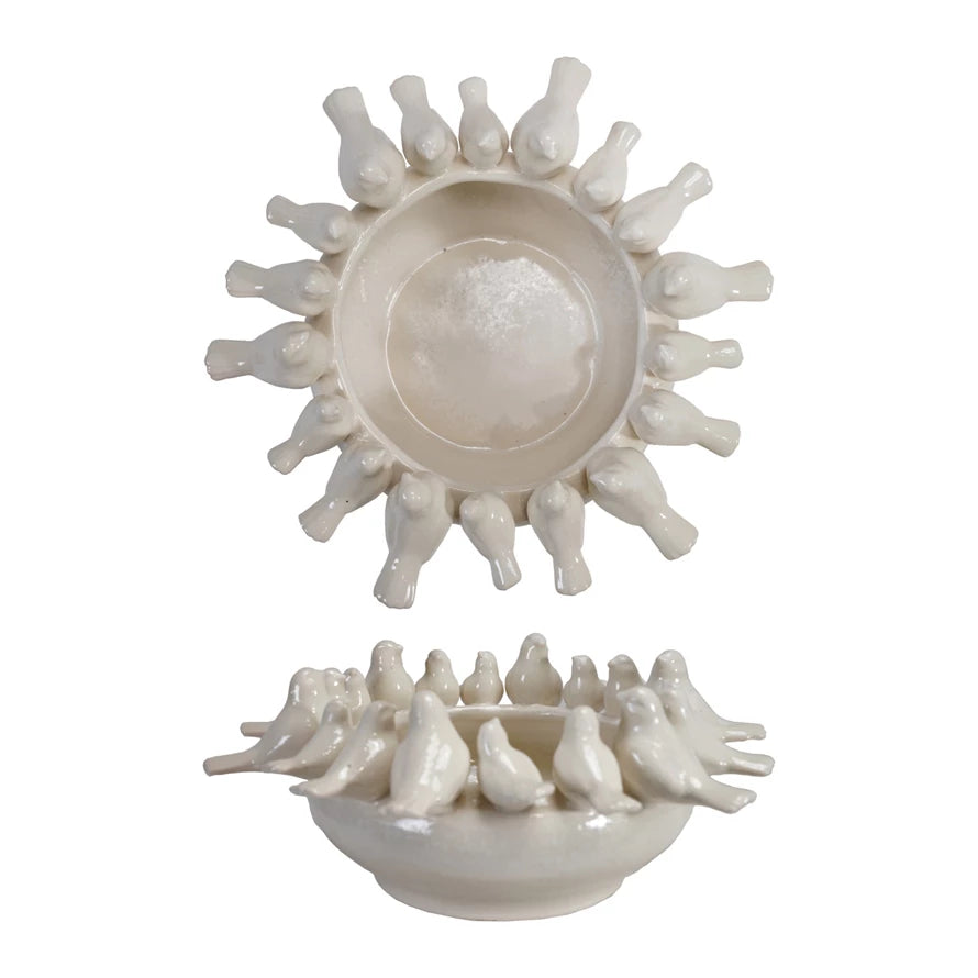 Decorative ceramic piece with birds on a white background