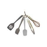 Set of kitchen utensils including a spatula, ladle, and whisk on a white background