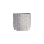 Decorative pot with a grid pattern on a white background