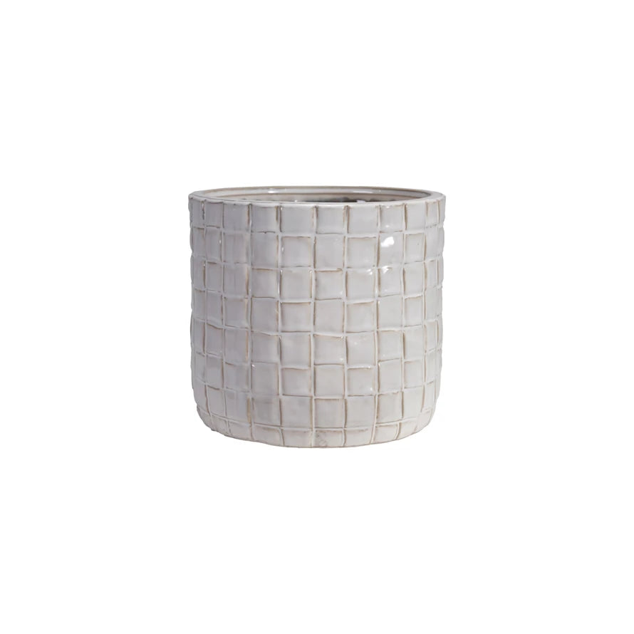 Decorative pot with a grid pattern on a white background
