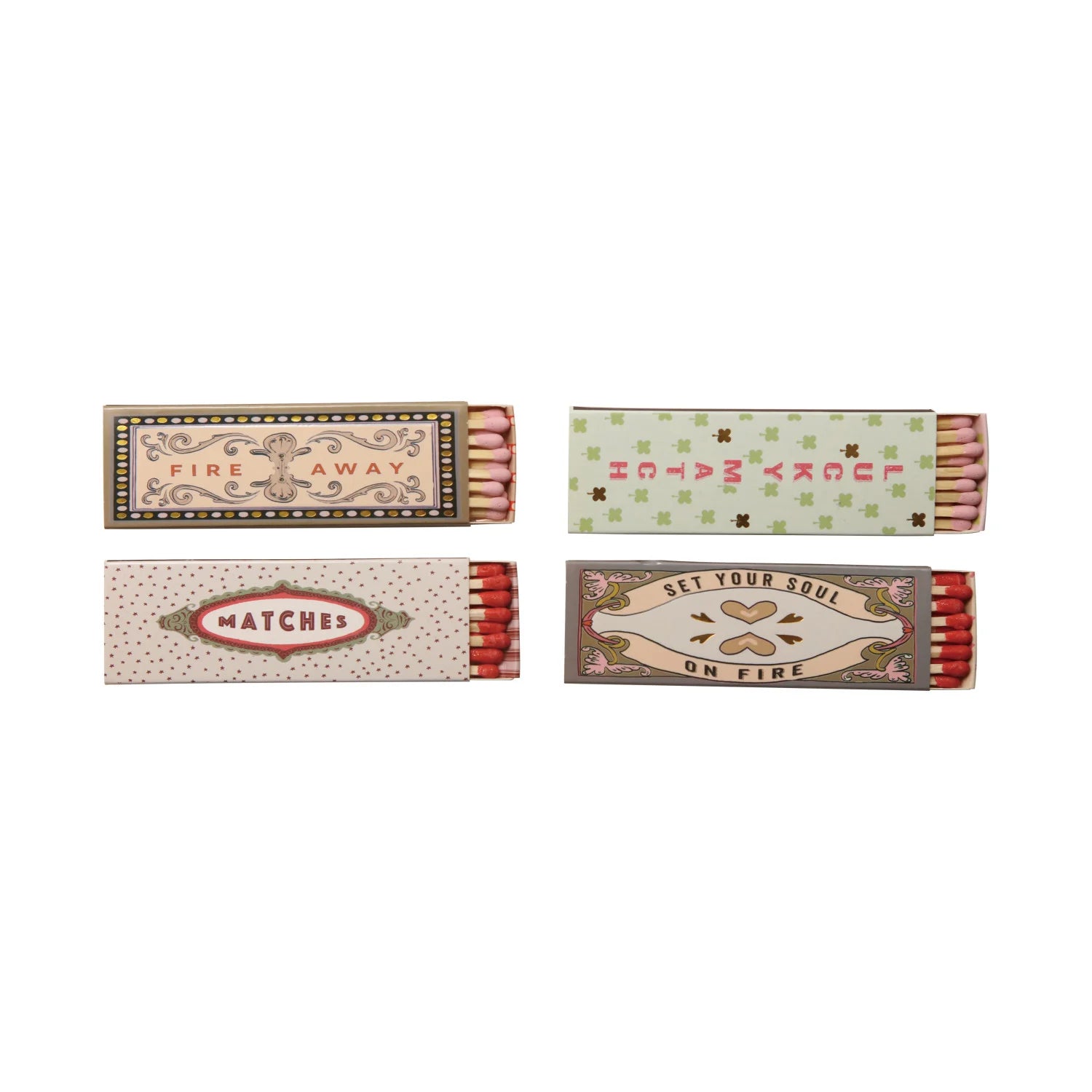 Four matchboxes with decorative labels on a white background