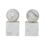 Two marble spheres bookends on square bases against a white background