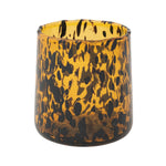Tortoiseshell-patterned drinking glass on a white background