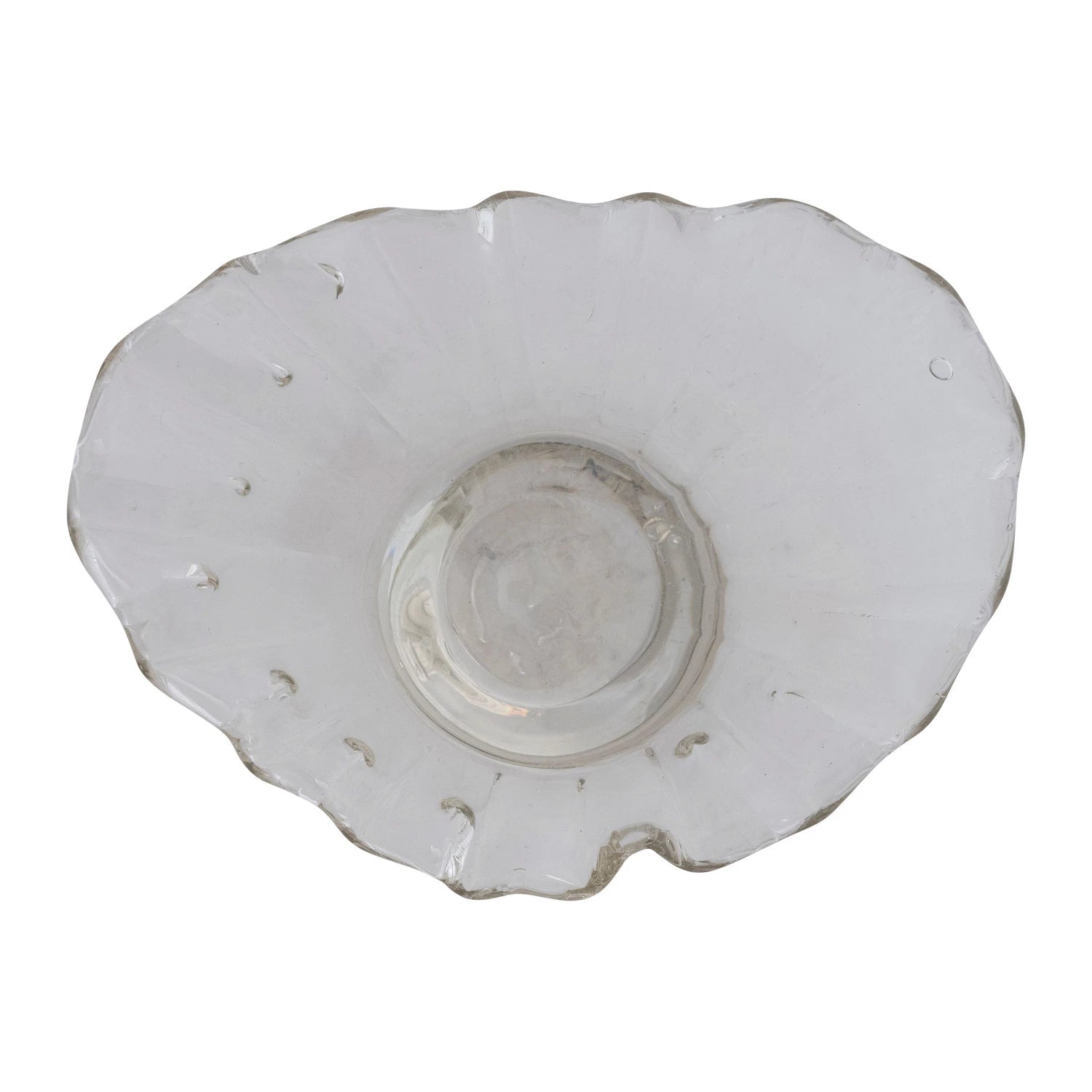 White ceramic plate with scalloped edge on a white background