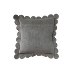 Gray pillow with scalloped edge on a white background