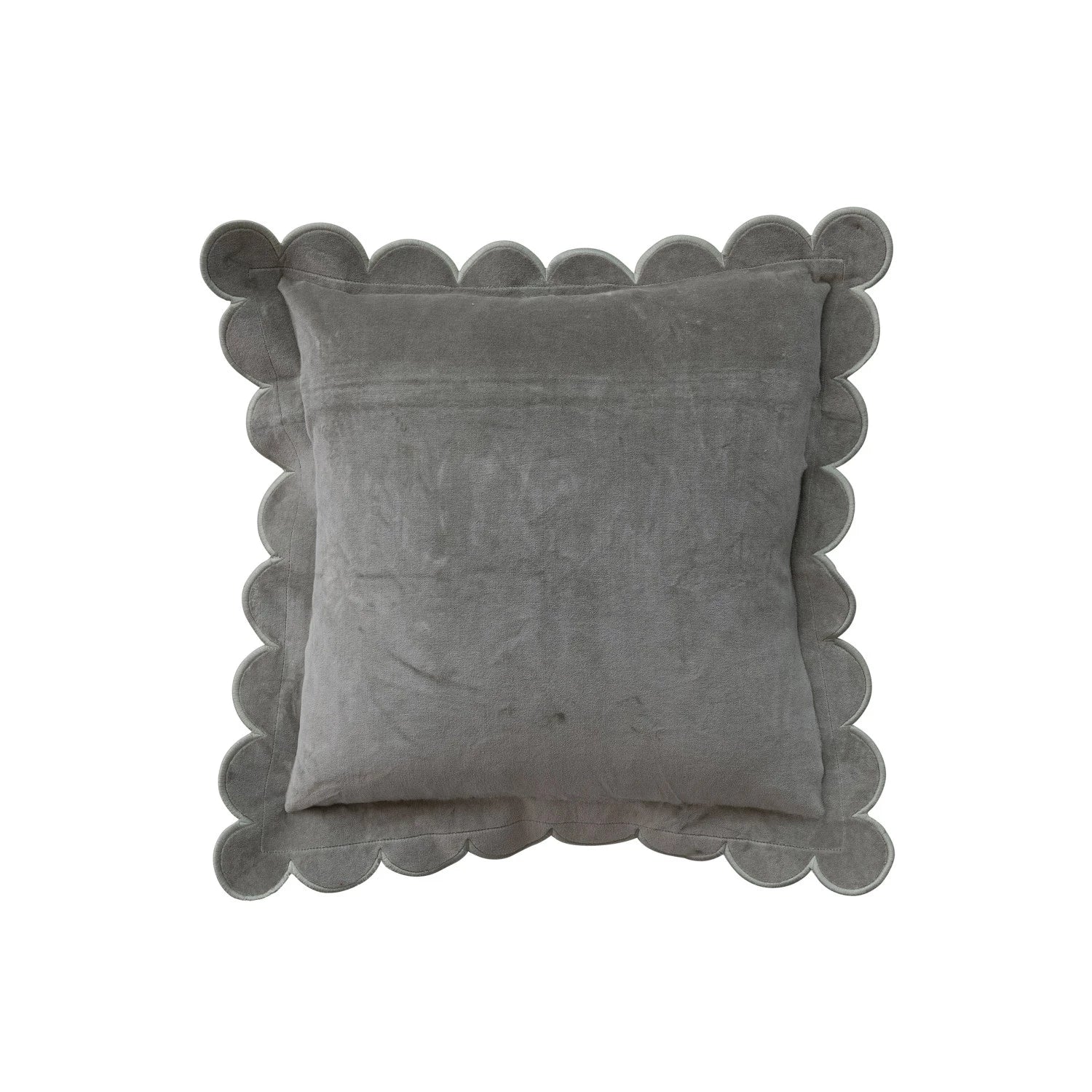 Gray pillow with scalloped edge on a white background