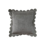 Gray pillow with scalloped edge on a white background