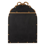 A black arched mirror with gold-tone metal trim, decorative finials at the top, and brass grommets along the edges, shown against a plain white background.
