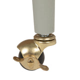 Gold caster wheel with a black rubber wheel on a white background
