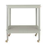 A light gray two-tier rolling bar cart with gold-tone casters and brass hardware, shown against a plain white background.