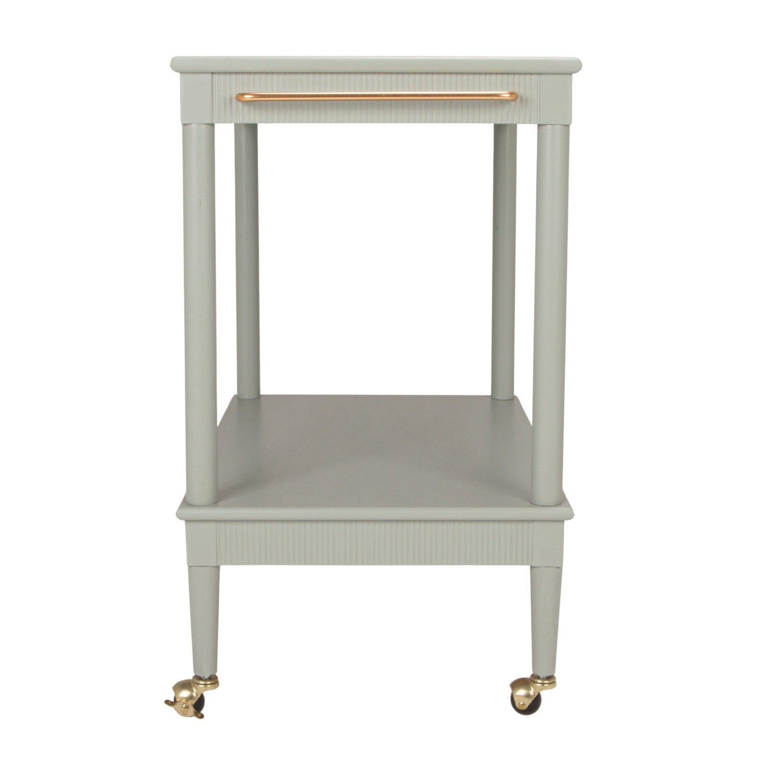 A light sage green two-tier side table with a single drawer on top featuring a copper-toned metal handle, supported by four legs with brass caster wheels.