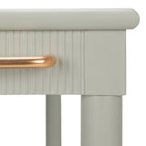 Close-up of a light gray cabinet with a gold handle on a white background