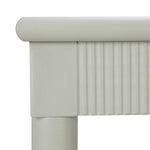 Close-up of a light gray upholstered headboard on a white background