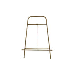 Brass metal easel on a white background