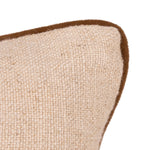 Close-up of a woven beige cushion with a contrasting brown piped edge on a white background.