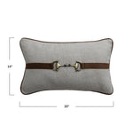 Gray pillow with a brown belt and brass buckle on a white background