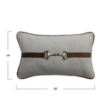 Gray pillow with a brown belt and brass buckle on a white background